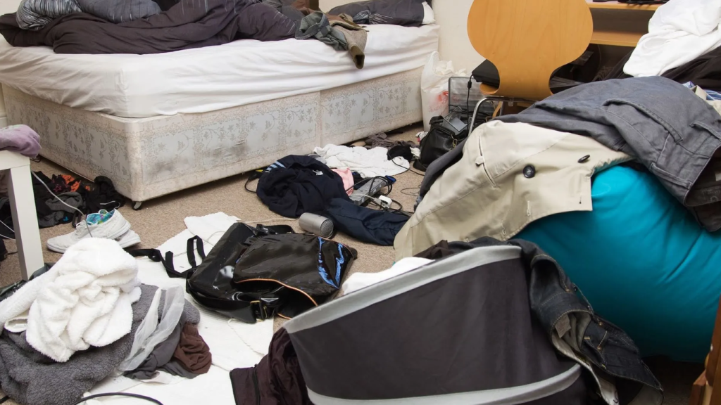 A room full of unused clothes - hoarders house